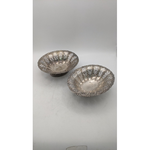 212 - A pair of Atkins Brothers silver pierced pedestal pin dishes of oval form, bearing different dates t... 