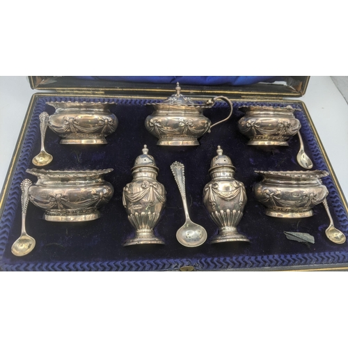 214 - A Coopers Brothers & Sons seven piece silver condiment set, bearing different date letters, having e... 