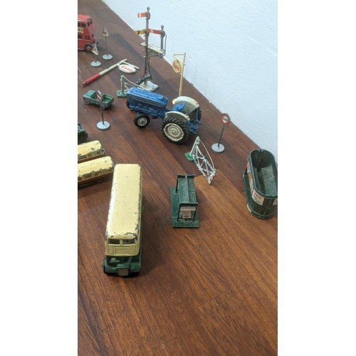 217 - Seven Dinky diecast model vehicles to include trains, a bus, a tractor, a rubbish truck, along with ... 