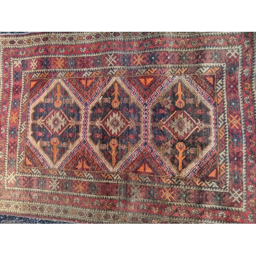 356 - Three rugs, one runner with three diamond shaped motifs on a red background another decorated with a... 