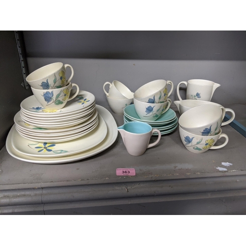 363 - A part Poole pottery dinner service to include cups, saucers, dinner plates, meat plates and other i... 