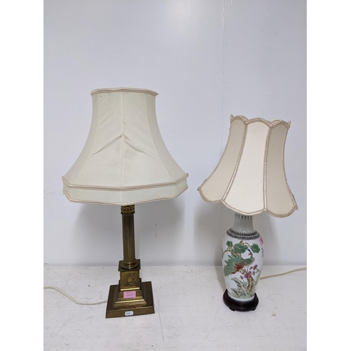 367 - ***THIS LOT HAS BEEN WITHDRAWN***A brass Corinthian column table lamp on square base with fabric sha... 