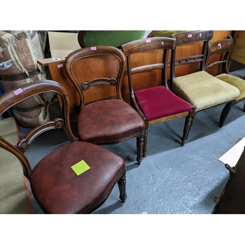 371 - A mixed group of 19th century chairs to include two Victorian balloon back chairs with red leather s... 