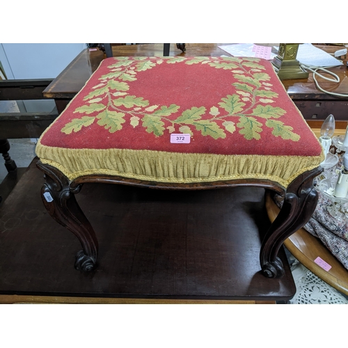 372 - A Victorian rosewood stool with tapestry upholstered top on carved cabriole legs with scrolled end f... 