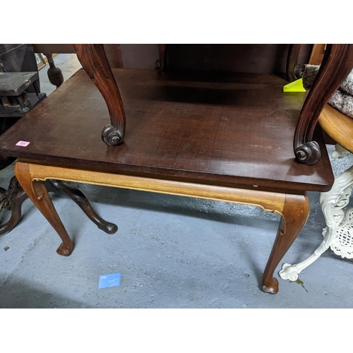 373 - A mahogany table with later top on shaped legs and pad feet 60cm x 97cm x 64cm, along with an oak tw... 