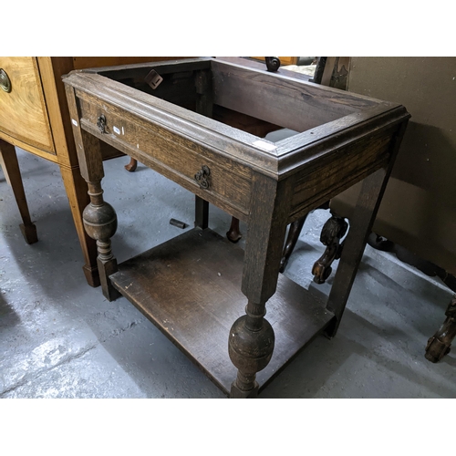 373 - A mahogany table with later top on shaped legs and pad feet 60cm x 97cm x 64cm, along with an oak tw... 