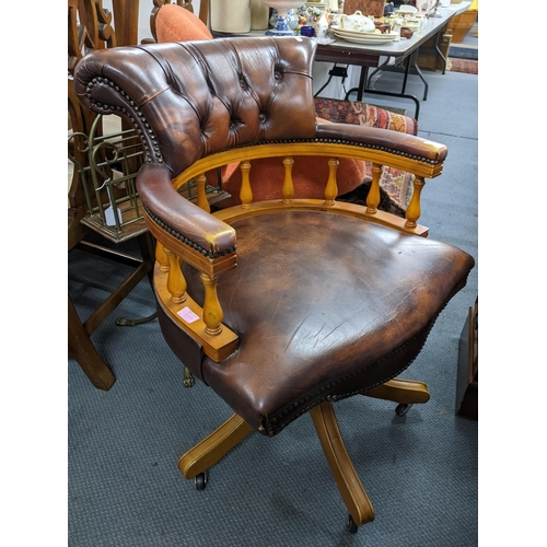 377 - A reproduction yew wood twin pedestal writing desk with gilt tooled leather scriber, above one long ... 