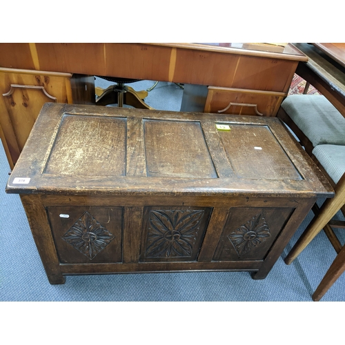 378 - A small oak blanket chest with panelled and carved front on stile feet 54cm x 92cm x 44cm Location: ... 