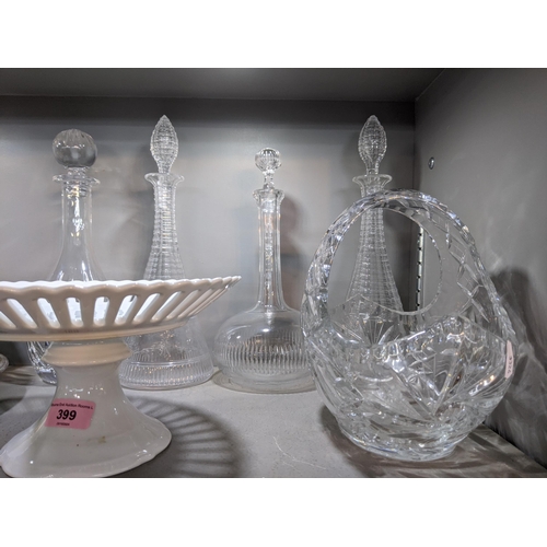 399 - A mixed lot to include some silver plate, a Wedgwood dish, four glass decanters with stoppers, door ... 