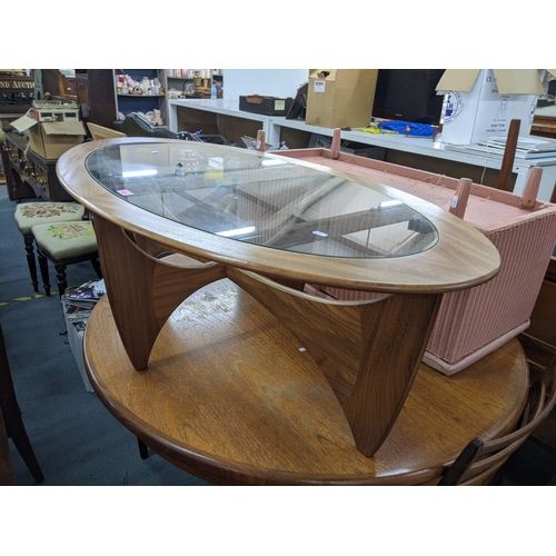 400 - A G-Plan Astro oval coffee table with a clear glass top 122cm x 66cm w Location:A2B
If there is no c... 