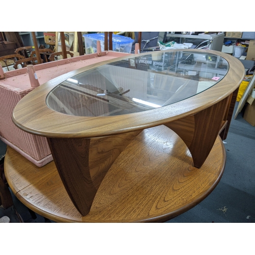 400 - A G-Plan Astro oval coffee table with a clear glass top 122cm x 66cm w Location:A2B
If there is no c... 