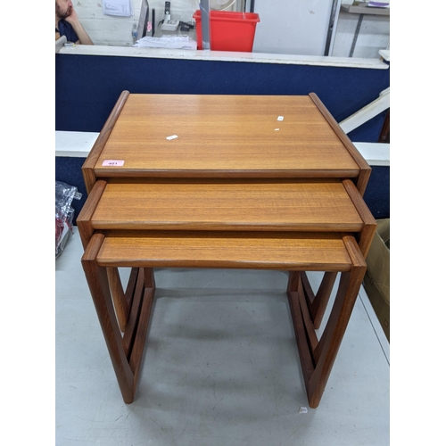 401 - A G-Plan nesting set of teak tables 53.5cm w x 42cm d x 49cm h Location: RWM
If there is no conditio... 