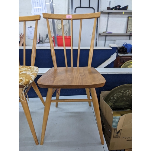 402 - A pair of blonde Ercol spindle back dining chairs Location: RWM
If there is no condition report show... 