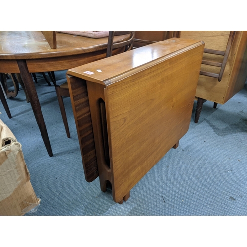 403 - A possibly McIntosh teak drop leaf table 83cm w x 76cm h x 22cm/ 145  Location: LWM
If there is no c... 