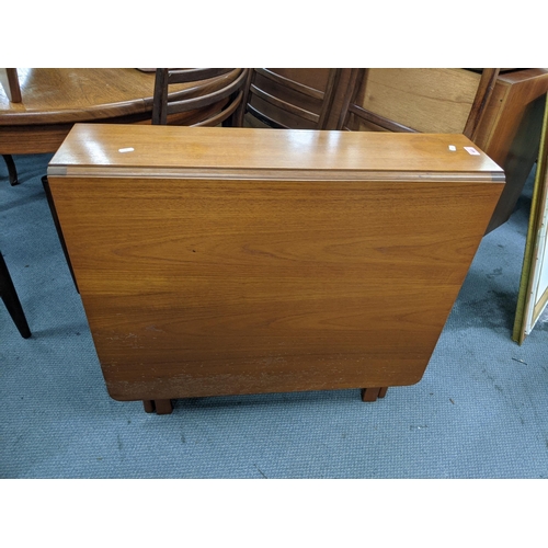 403 - A possibly McIntosh teak drop leaf table 83cm w x 76cm h x 22cm/ 145  Location: LWM
If there is no c... 