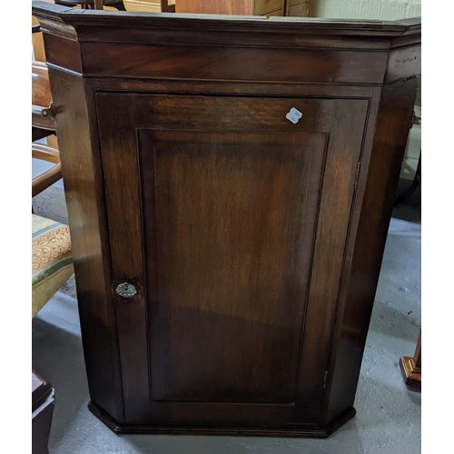 492 - A George III mahogany wall hanging corner cabinet, 108cm h x 81cm, two Edwardian mahogany circular t... 