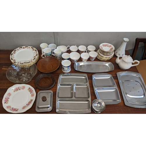 304 - A mixed lot to include stainless steel platters, a crystal glass bowl, a Colclough part teaset and o... 