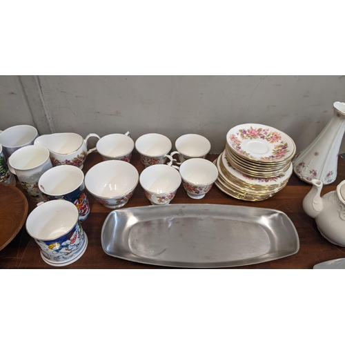 304 - A mixed lot to include stainless steel platters, a crystal glass bowl, a Colclough part teaset and o... 