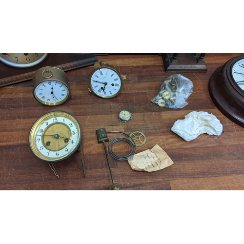 307 - A collection of clocks and watches to include four mantle clocks, a Keith 8 day wall clock, a French... 