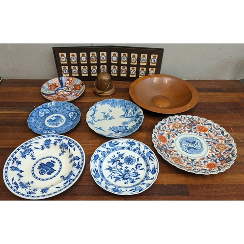 317 - Japanese plates to include Imari and blue and white examples, a Meissen Onion pattern dish, a copper... 