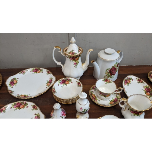 323 - A collection of teaware to include mostly Royal Albert Country Roses pattern items and Royal Crown D... 