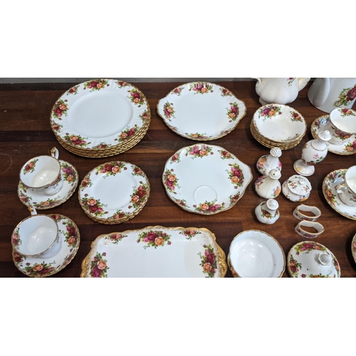 323 - A collection of teaware to include mostly Royal Albert Country Roses pattern items and Royal Crown D... 