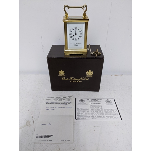 386 - A Charles Frodsham brass cased, five window carriage clock, in original box, with key, guarantee and... 