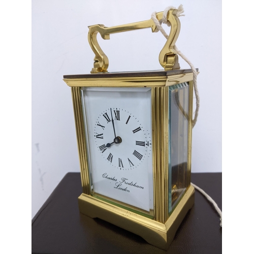 386 - A Charles Frodsham brass cased, five window carriage clock, in original box, with key, guarantee and... 