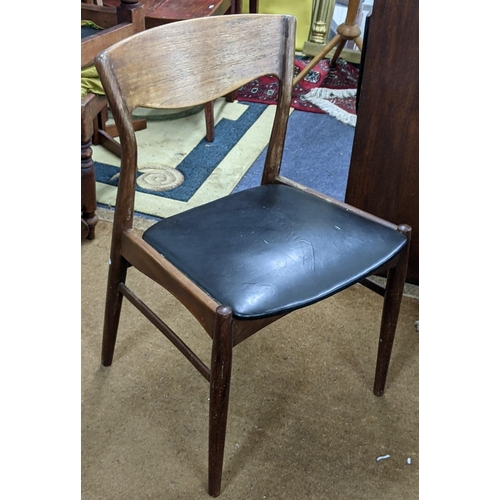 406 - A mid 20th century Scandinavian teak dining chair with a black vinyl seat
Location:A1B If there is n... 