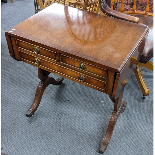 409 - A reproduction mahogany sofa table having two fall flaps and three drawers, 70.5h x 67w
Location:RAB... 