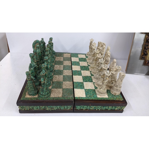 411 - A resin folding chess board complete with chess pieces
Location:A2B If there is no condition report ... 