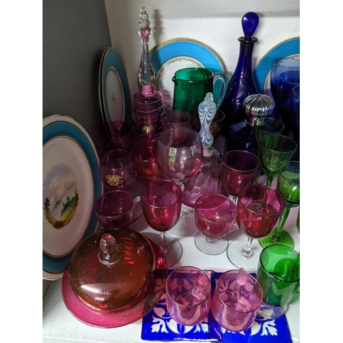 425 - A mixed lot of 19th century and later table glass and ceramics to include two cranberry glass bells,... 