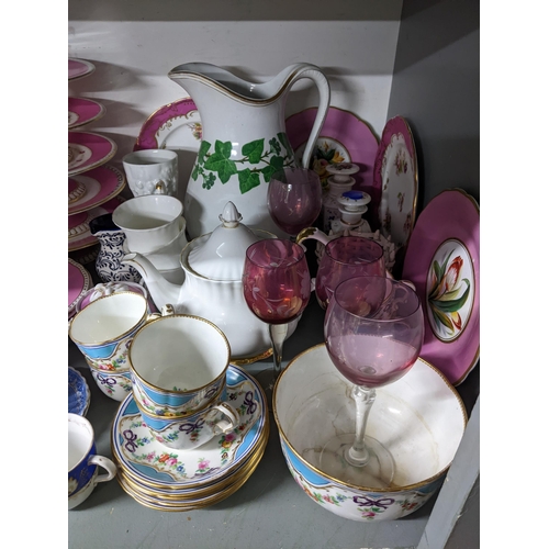 425 - A mixed lot of 19th century and later table glass and ceramics to include two cranberry glass bells,... 