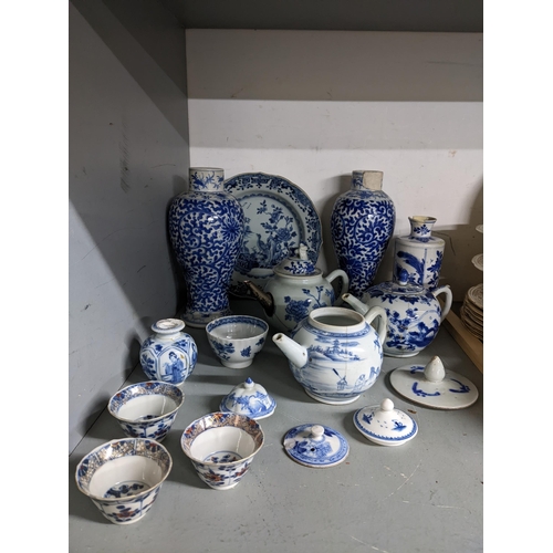 428 - A collection of 18th and 19th century blue and white ceramics to include a pair of baluster vases, t... 