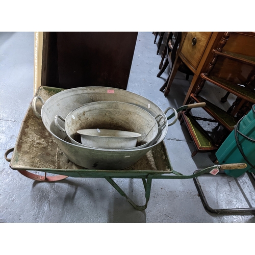 433 - A vintage painted iron wheelbarrow, along with a Rowan & Co Butler's sink, and a graduated set of tw... 