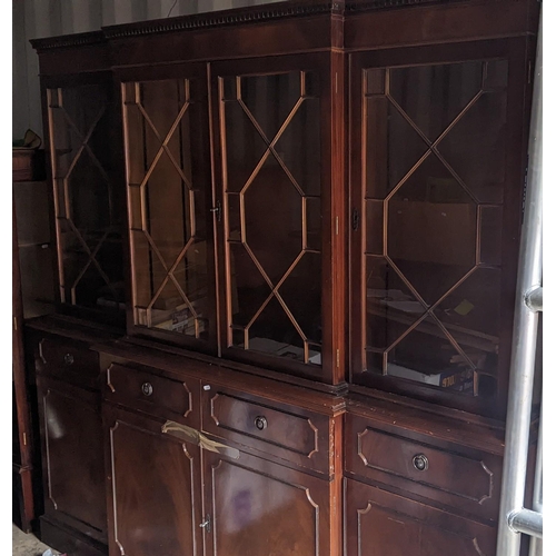 454 - A 20th century mahogany cabinet with a glazed and shelved top, over storage under a long drawers210c... 