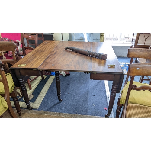 465 - An early 19th century mahogany gateleg extending dining table with one extra leaf, together with six... 