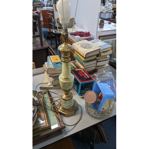 494 - A mixed lot to include a slate mantel clock, a silver plated teapot with milk jug, vintage tins, a W... 