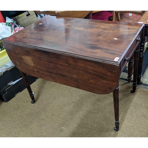 496 - An early 19th century mahogany Pembroke table with a single drawer and turned legs, 72.5cm high x 96... 