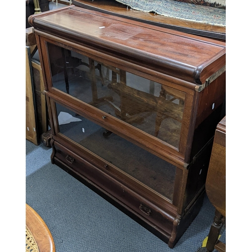 499 - An early 20th century Globe Wernicke mahogany two section bookcase with a single drawer below, 88cm ... 