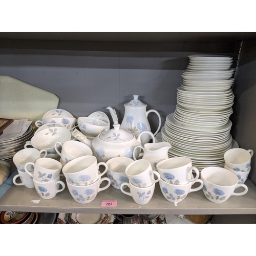 393 - A Wedgwood Ice Rose pattern dinner service to include plates, saucers, cups, soup bowls, a milk jug,... 