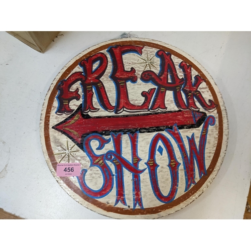 456 - A circular wooden painted sign, 'Freak Show', 32.5cm dia
Location: G If there is no condition report... 