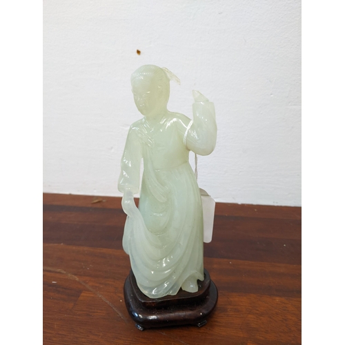 460 - A 20th century Chinese jade coloured figure of a Geisha girl, in a dress on a moulded base, A/F
Loca... 