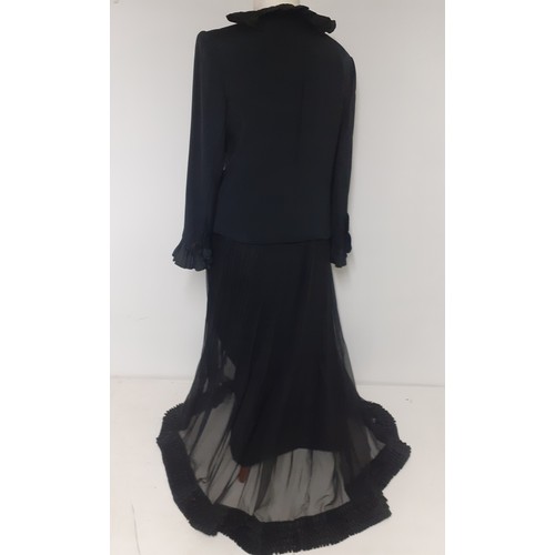 52 - Hartnell, British Designer- A black evening jacket with ruffled collar and cuffs approx 38