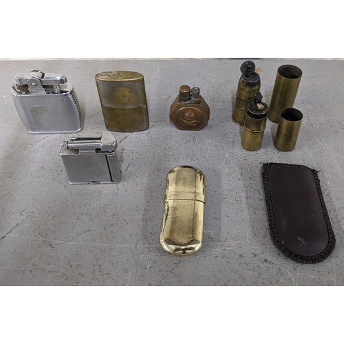 102 - A collection of vintage cigarette lighters to include a Ronson viking, a Cyklon trench art lighters ... 