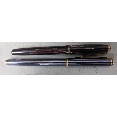 107 - Two unboxed pens to include a Parker fountain pen with a 14ct gold nib and a waterman ball point pen... 