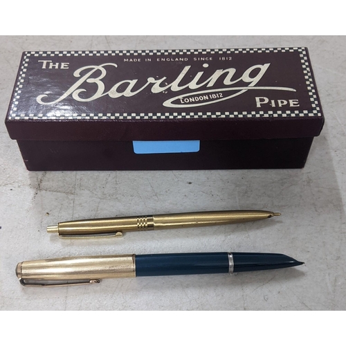 111 - A Parker fountain pen with a gold plated lid and a gold coloured ballpoint pen both housed in a Barl... 