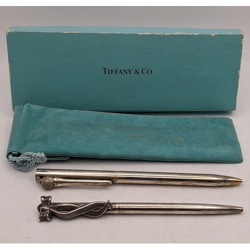 112 - Two Tiffany & Co silver pens marked 'Sterling Silver' in a Tiffany & Co cover and box
Location:CAB7
... 