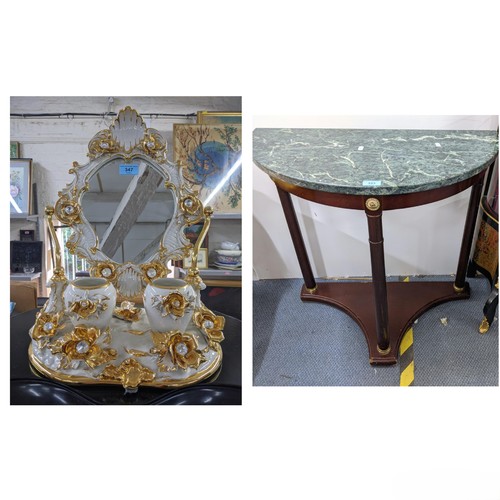 602 - A modern bathroom swivel ceramic mirror decorated with flowers and gilding with two pots in front of... 