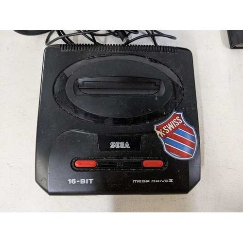 558 - Nintendo Entertainment system and a Sega 16-bit Megadrive II and games to include NBA Live 96, Super... 